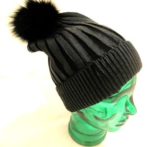 Black hat with pompom